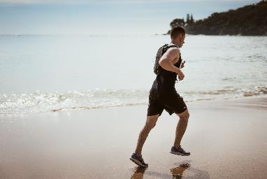 A man running on the beach.